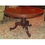 A Victorian mahogany loo table of circular form with moulded outline raised on a central squat