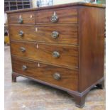A Regency mahogany chest of three long and two short graduated drawers raised on bracket supports,