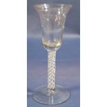 A Georgian wine glass with bell shaped bowl, latticino twist stem, raised on a circular foot