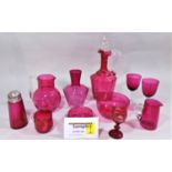 A collection of 19th century cranberry glass wares comprising two decanters, two carafes, water jug,