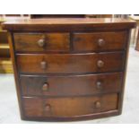 A Victorian mahogany bow fronted bedroom chest of two short over three long graduated drawers raised