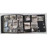 An album containing a collection of black and white photographs relating to the Korean war
