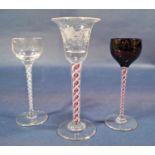 A Georgian stemmed wine glass with bell shaped bowl and engraved trailing fruiting vine detail, with