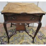 A late 19th century envelope card table in mahogany with shaped outline, frieze drawer, raised on