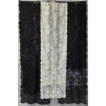 Three 19th century long narrow lace shawls; ivory shalw is 250 x 37cm , black shawls are 240 x 46