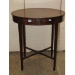 A Georgian mahogany occasional table of oval form with shallow frieze drawer and inlaid detail