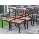 A set of six Regency rosewood dining chairs with carved splats and fluted forelegs, with cane work