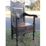 An old English oak wainscot chair, the carved and panelled back with Tree of Life and further