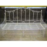 An unusual cream painted iron framed sofa with simple scrolled detail, sprung seat, oatmeal ground