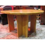 A good quality contemporary oak dining/centre table of oval form with block work top raised on