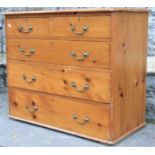 A Victorian stripped pine bedroom chest of two short over three long graduated drawers, with later