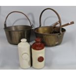 Four 19th century copper pots and pans and two earthenware hot water bottles