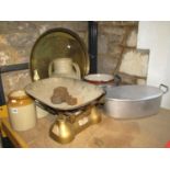 An Eastern circular engraved brass tray, aluminium fish kettle, further aluminium pan with loose