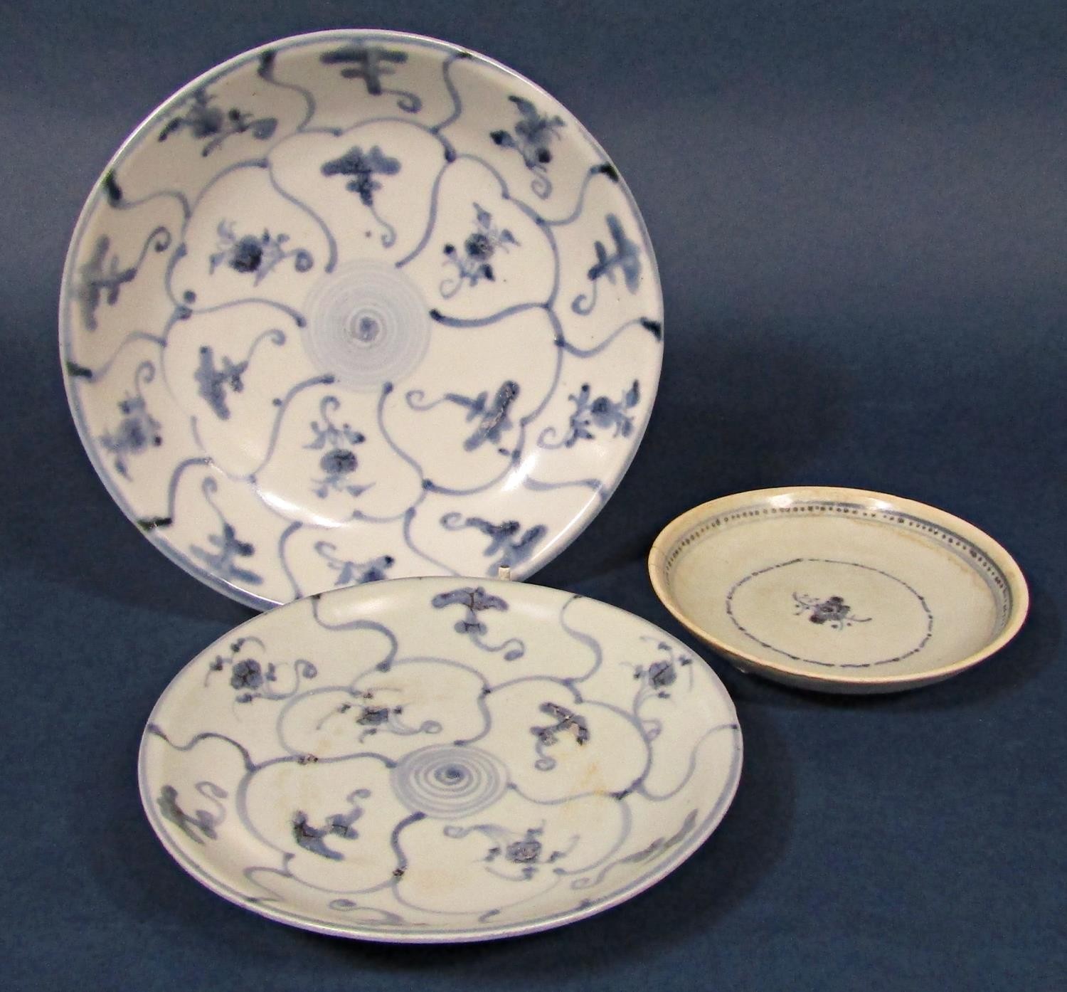 Three blue and white dishes raised from the Tek Sing Cargo, two bearing Nagel Auctions labels