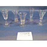 A collection of fourteen stemmed wine glasses of varying designs, on turned and knopped stems,