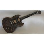 An electric guitar - inscribed to headstock 'Made in Lockdown 2020' with richly carved wooden