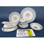 A collection of Royal Doulton Rose Elegans dinner and teawares including an oval meat plate, sauce