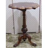 A Victorian walnut snap top occasional table with circular scallop shaped moulded and segmented