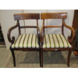 A pair of 19th century mahogany bar back carver chairs, with open scrolled arms, drop in upholstered