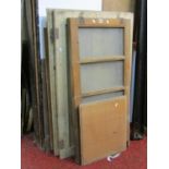 A pair of stripped pine panelled cupboard doors, a further pair of oak doors etc