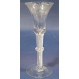 A Georgian stemmed wine glass, the bell shaped bowl etched with trailing foliate detail, with