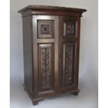 Collectors cabinet in bog oak with eight mahogany drawers, with fish scale detail to the top and