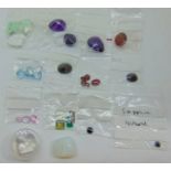 Collection of loose gemstones to include spinel, amethyst, hessonite, etc and a pair of heart shaped