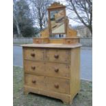 A Victorian stencilled and grained pine dressing chest with raised rectangular mirror, flanked by