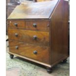 A 19th century mahogany bureau, the fall flap with flamed mahogany veneer, over two long and two