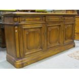 A good quality reproduction dresser base (possibly chestnut) enclosed by three fielded and moulded