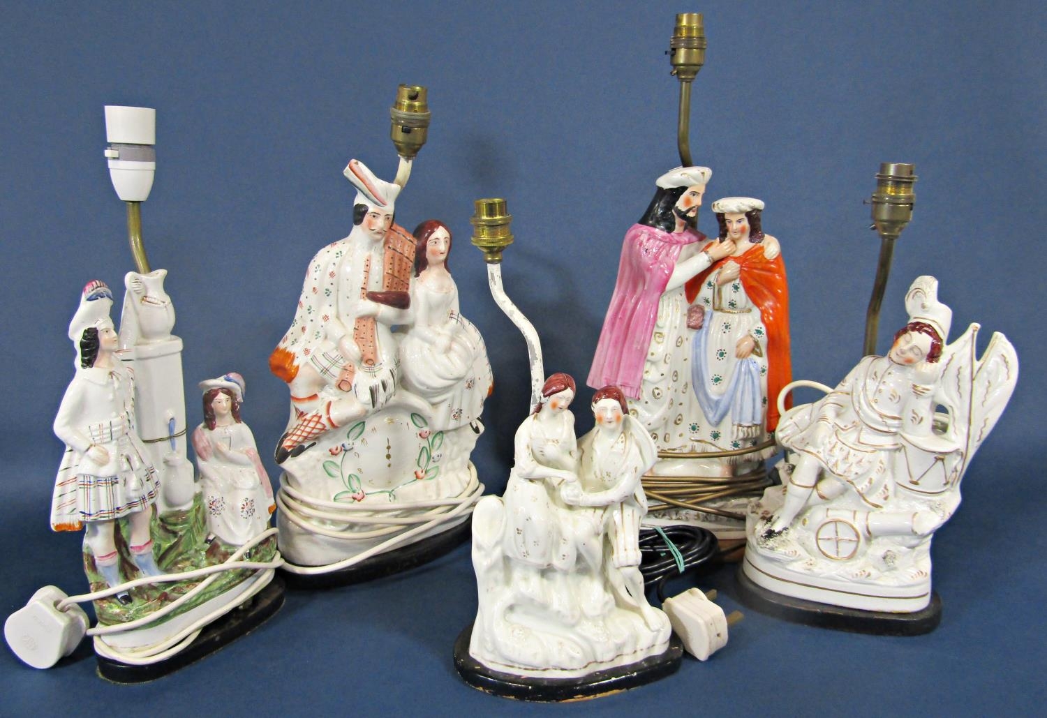 A collection of five 19th century Staffordshire figure groups converted to table lamp bases