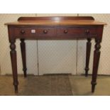 A Victorian mahogany side table fitted with two frieze drawers raised on turned tapered supports, 92
