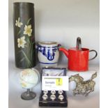 Four blue and white German earthenware flower pots, a globe, a red distressed watering can, box