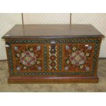 An Indian stained pine box with hinged lid, the front elevation with painted foliate detail, 80cm