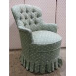 A small Victorian style button back bedroom or parlour chair with shaped outline and repeating