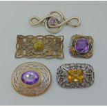 Group of five silver / white metal gem-set brooches to include a citrine example in the manner of