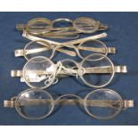 Four pairs of Georgian silver framed folding spectacles