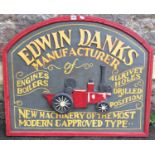 A vintage style painted wooden sign of arched form with raised lettering and relief advertising