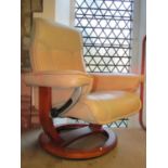 An Ekornes Stressless adjustable lounge chair with soft stitched cream leather upholstery raised