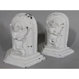 Book ends, a pair of cast brass or possibly bronze cherubs playing lyres in a recent white painted