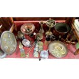 A collection of metal, mainly brassware, to include horse brasses, oil lamp base with three mythical