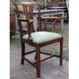 A Georgian elm elbow chair with pierced comb splat, with hand worked tapestry seat on square cut