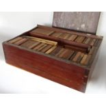 A mahogany box containing various samples of hardwoods for the British Empire