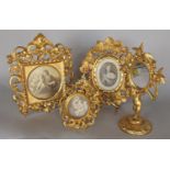 Three gilt carved wood Renaissance style Italian miniature picture frames and a similar mirror