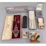 Collection of costume jewellery to include two decorative paste set pendants, hexagonal gold