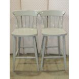 A pair of contemporary Windsor style lathe back breakfast stools with painted finish together with a