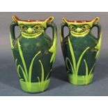 A pair of early 20th century Allervale three handled vases with moulded and painted grotesque mask