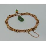Antique 9ct gate link bracelet with nephrite jade acorn and four-leaf clover charms, 10.2g (one link