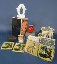 A collection of 19 ceramic tiles by John and Fiona Cutting with decoration of birds, a hare,