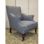 An Edwardian drawing room chair with shaped outline, blue ground repeating floral patterned